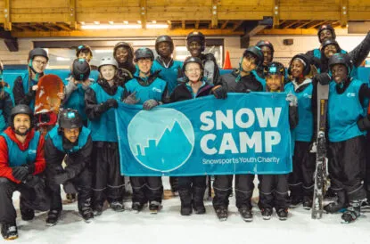 Snow Camp Group holding sign