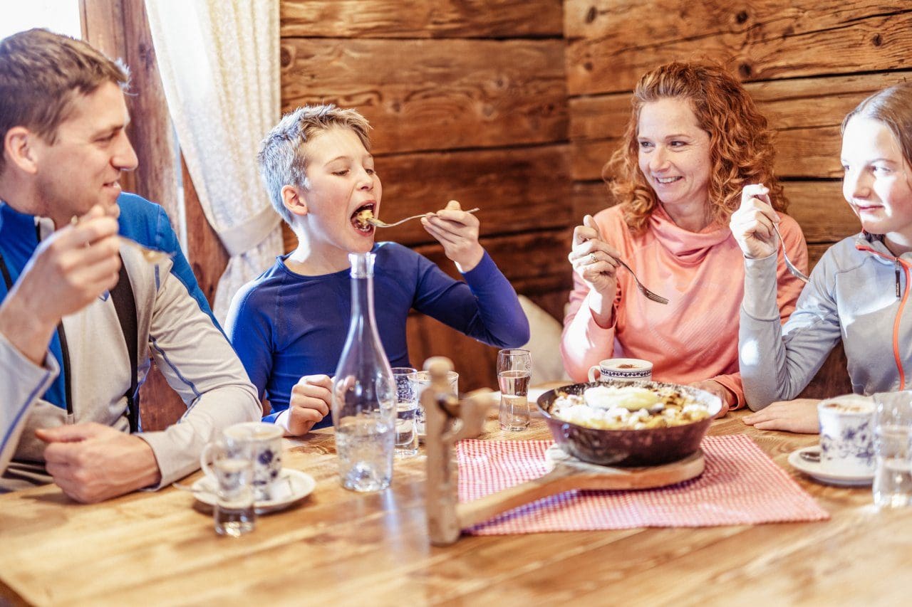 Skiing in Tirol, Austria - A family enjoying local dishes in Ski Juwel Alpbachtal Wildschoenau. Credit shootandstyle
