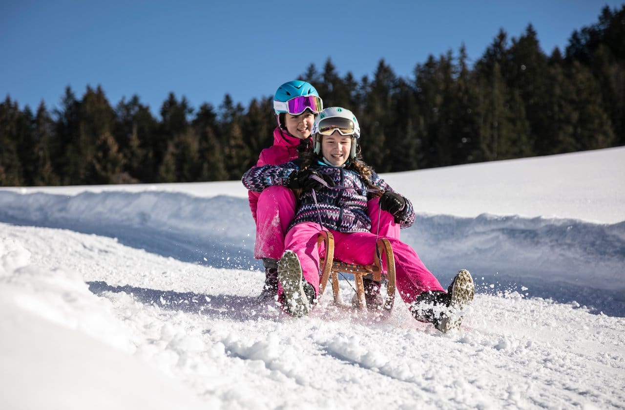 Skiing in Tirol, Austria - Tobogganing in St. Johann in Tirol. Credit Mirja Geh Photography