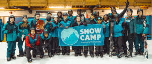 Snow Camp Group holding sign
