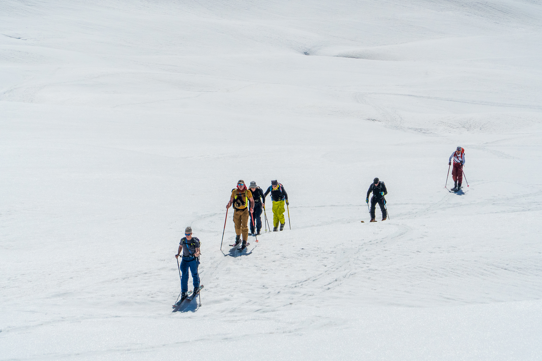 Ski tourer climbing over a mountain ridge on a Ski Touring weekend
